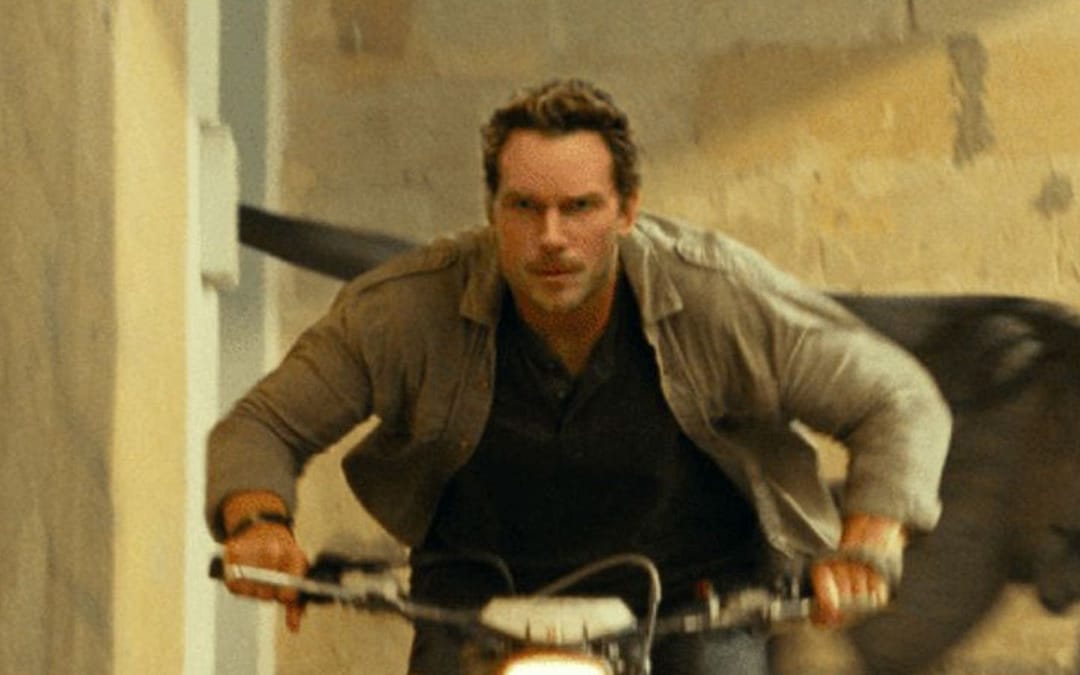 Chris Pratt Flees From An Atrociraptor In New Image From ‘Jurassic World: Dominion’